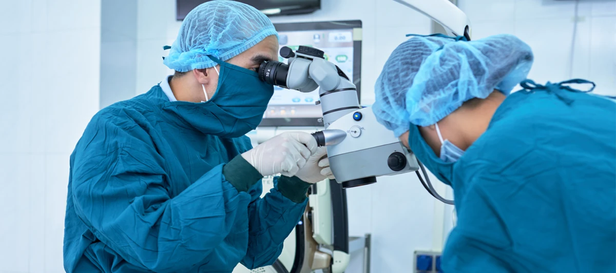 Eye surgeons performing cataract surgery